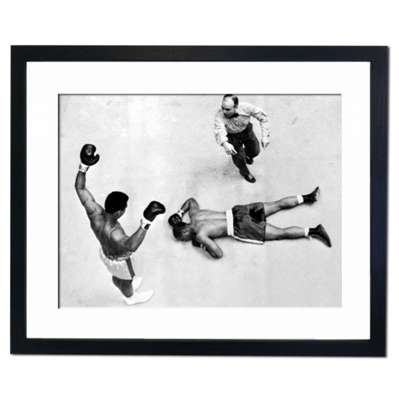 Champion Cassius Clay Stands Over Challenger Zora Folley Madison